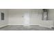 Garage interior with white walls, storage, and water heater at 53 Hillwood Dr, Sanford, NC 27332
