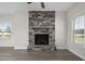 Living room featuring a stone fireplace and hardwood floors at 53 Hillwood Dr, Sanford, NC 27332
