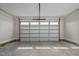 Spacious two-car garage with white walls and a finished concrete floor at 53 Hillwood Dr, Sanford, NC 27332