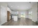 Open concept kitchen with island, stainless steel appliances, and backyard access at 53 Hillwood Dr, Sanford, NC 27332