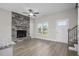 Bright living room with hardwood floors, fireplace, and view to kitchen at 53 Hillwood Dr, Sanford, NC 27332