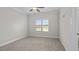 Bright bedroom with neutral carpeting and large window at 53 Hillwood Dr, Sanford, NC 27332