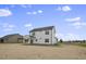 Rear view of two-story house, showcasing backyard at 53 Hillwood Dr, Sanford, NC 27332