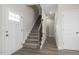 Staircase with carpeted steps and wood railing at 53 Hillwood Dr, Sanford, NC 27332