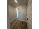 Bright hallway with light brown wood-look flooring at 1031 Westerland Way # 46, Durham, NC 27703
