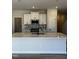 Modern kitchen features a large island, stainless steel appliances, and white cabinets at 1031 Westerland Way # 46, Durham, NC 27703