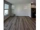 Spacious living room with hardwood floors and large windows at 1031 Westerland Way # 46, Durham, NC 27703