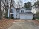 Two-story house with a double garage and large windows at 5604 Torness Ct, Raleigh, NC 27604