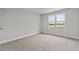 Spacious bedroom with large window and carpet flooring at 188 Hillwood Dr, Sanford, NC 27332