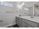 Modern bathroom with double vanity,tiled floor, and large mirror at 188 Hillwood Dr, Sanford, NC 27332