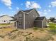 Two-story house with gray siding, covered porch, and a large backyard at 188 Hillwood Dr, Sanford, NC 27332