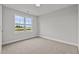 Bright bedroom featuring a large window and carpet flooring at 188 Hillwood Dr, Sanford, NC 27332