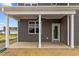 Covered back porch with ceiling fan and exterior access at 188 Hillwood Dr, Sanford, NC 27332