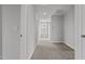 Bright hallway with carpet flooring and a window at 188 Hillwood Dr, Sanford, NC 27332