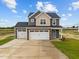 Two-story home with two-car garage and landscaped yard at 188 Hillwood Dr, Sanford, NC 27332