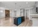 Open floor plan showing kitchen, island, and Gathering room with fireplace at 188 Hillwood Dr, Sanford, NC 27332