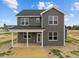 Two-story house with gray siding, covered porch, and a large backyard at 188 Hillwood Dr, Sanford, NC 27332