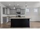 Modern kitchen with gray cabinets and large island at 188 Hillwood Dr, Sanford, NC 27332