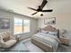 Virtually staged main bedroom with ceiling fan and ample space at 73 Calluna Dr, Clayton, NC 27520