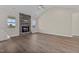 Living room with stone fireplace and hardwood flooring at 152 Hillwood Dr, Sanford, NC 27332