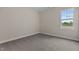 Spacious bedroom with neutral carpeting and large window at 152 Hillwood Dr, Sanford, NC 27332
