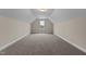 Spacious bonus room with carpeted floor and large window at 152 Hillwood Dr, Sanford, NC 27332