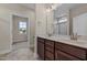 Double vanity bathroom with a walk-in shower at 152 Hillwood Dr, Sanford, NC 27332