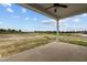 Covered patio overlooking open field, providing a relaxing outdoor space at 152 Hillwood Dr, Sanford, NC 27332