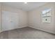 Simple bedroom with double doors and neutral carpeting at 152 Hillwood Dr, Sanford, NC 27332