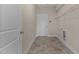 Laundry room with built-in shelving and tiled flooring at 152 Hillwood Dr, Sanford, NC 27332
