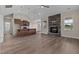Spacious living room with a stone fireplace and hardwood floors at 152 Hillwood Dr, Sanford, NC 27332