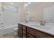 Bathroom with double vanity, white fixtures, and tile flooring at 152 Hillwood Dr, Sanford, NC 27332