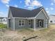 Gray house exterior with a covered porch and landscaping at 152 Hillwood Dr, Sanford, NC 27332