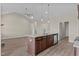 Open concept kitchen island and living area with hardwood floors at 152 Hillwood Dr, Sanford, NC 27332