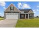 Two-story house with a two-car garage and gray siding at 152 Hillwood Dr, Sanford, NC 27332