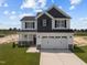 Two-story house with a two car garage and front yard at 114 Hillwood Dr, Sanford, NC 27332