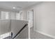 Upstairs hallway with doors to bedrooms and bathroom at 114 Hillwood Dr, Sanford, NC 27332