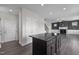 View of kitchen, dining area, and fireplace from entry at 114 Hillwood Dr, Sanford, NC 27332