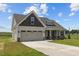 Two-story house with two-car garage and landscaped yard at 58 Hillwood Dr, Sanford, NC 27332