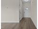 Bright entryway with wood-look flooring and white door at 58 Hillwood Dr, Sanford, NC 27332