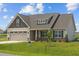 House exterior with neutral colors and a two-car garage at 58 Hillwood Dr, Sanford, NC 27332