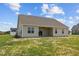 Beige house with covered patio, and spacious backyard at 58 Hillwood Dr, Sanford, NC 27332