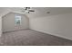 Bright bedroom featuring a ceiling fan and carpeted floors at 58 Hillwood Dr, Sanford, NC 27332
