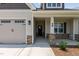 House exterior with stone accents and two-car garage at 58 Hillwood Dr, Sanford, NC 27332