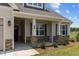 House exterior featuring stone accents and porch at 58 Hillwood Dr, Sanford, NC 27332