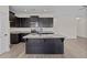 Kitchen island with granite countertop and dark cabinetry at 58 Hillwood Dr, Sanford, NC 27332