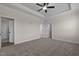 Main bedroom with carpet, ceiling fan and access to bathroom at 58 Hillwood Dr, Sanford, NC 27332