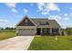Two-story house with two-car garage and front yard at 58 Hillwood Dr, Sanford, NC 27332