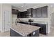 Modern kitchen with granite island and stainless steel appliances at 58 Hillwood Dr, Sanford, NC 27332