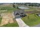 New house with driveway and pond in the background at 58 Hillwood Dr, Sanford, NC 27332
